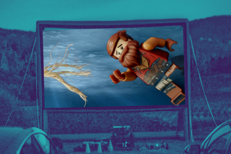 outdoor movie screen with lego figure from Cast Away remake