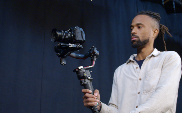 Richard holding a camera on a gimbal