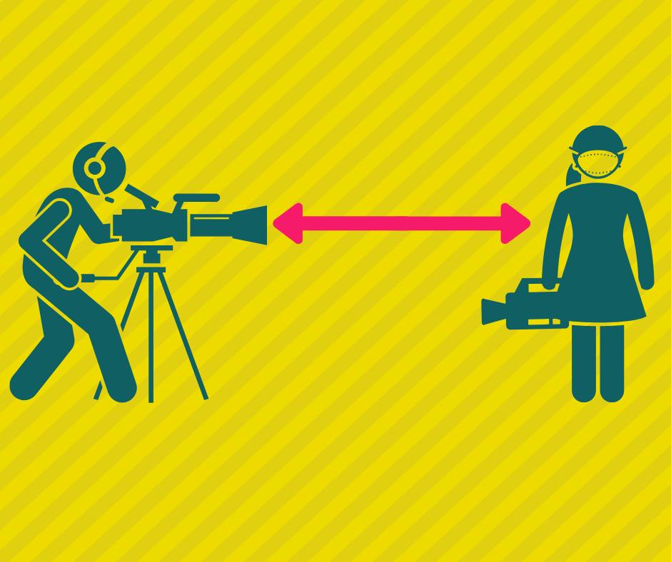 two people holding camera and standing 6 feet apart