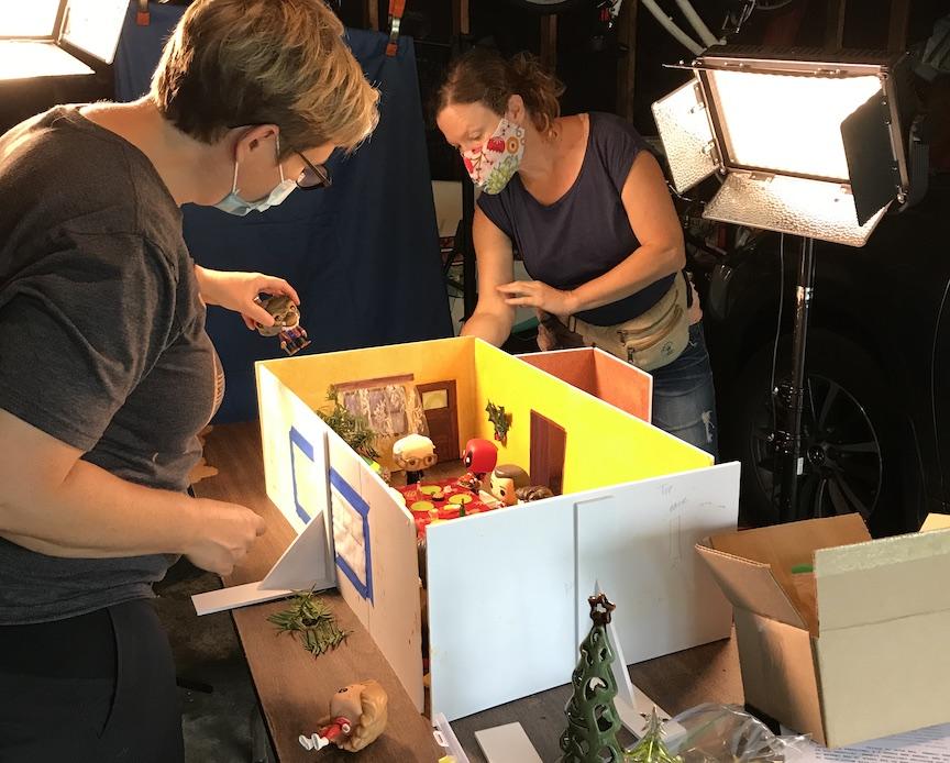 Two people building the animated sequence for Christmas Dinner
