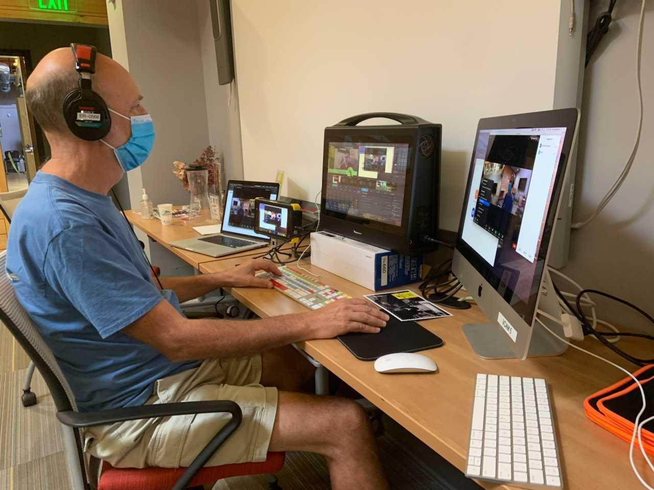Ken French edits livestream video at desk with computer monitor, and tricaster.