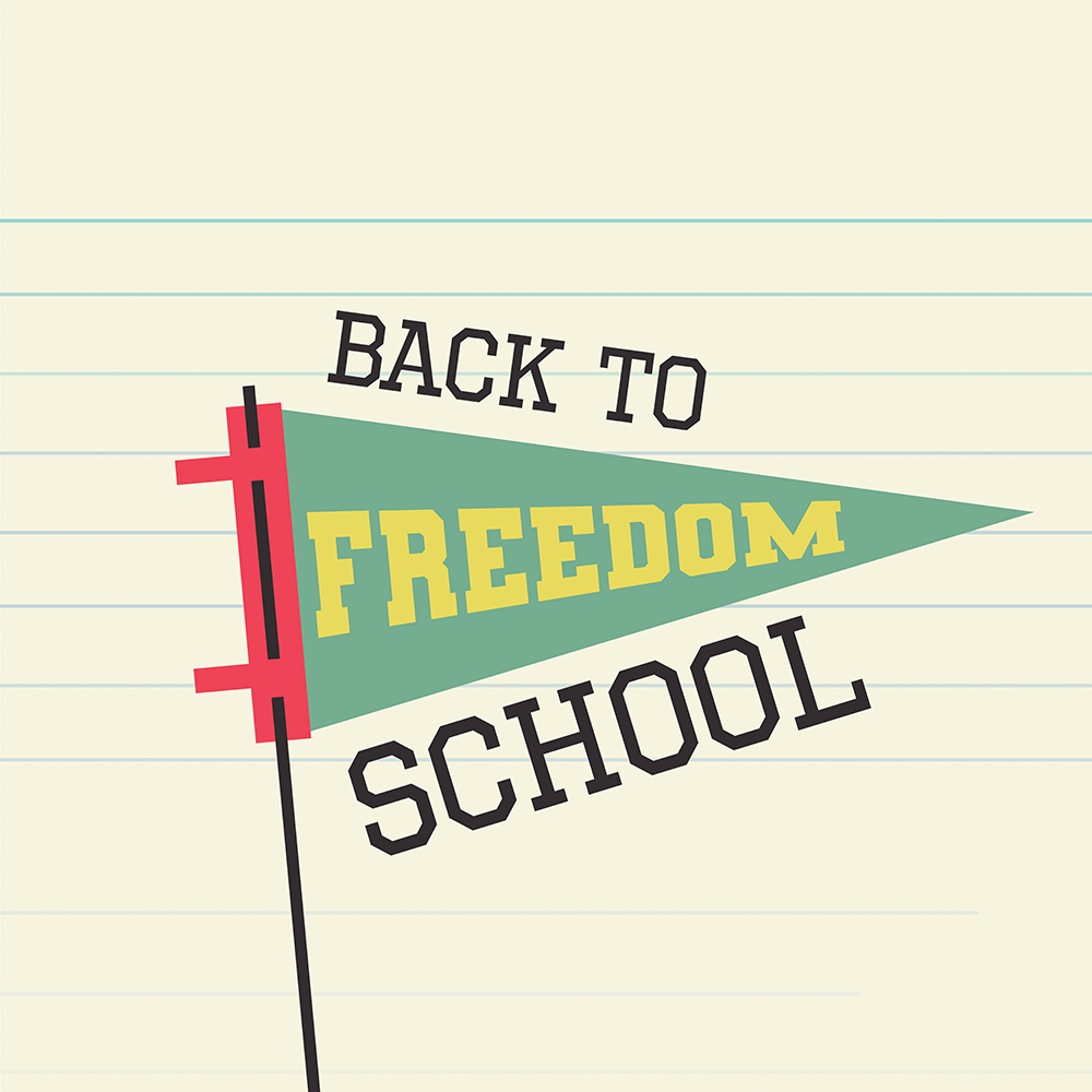 Back to Freedom school banner on a sheet of notebook paper