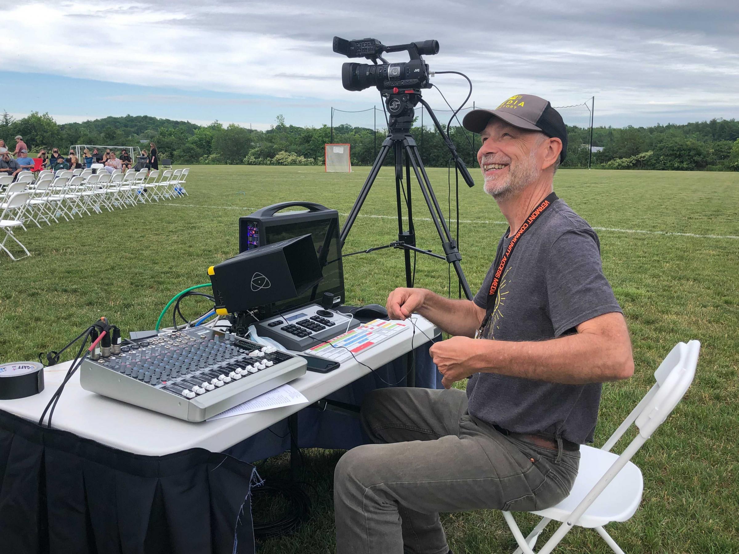 Ken at the controls for an outdoor graduation livestream