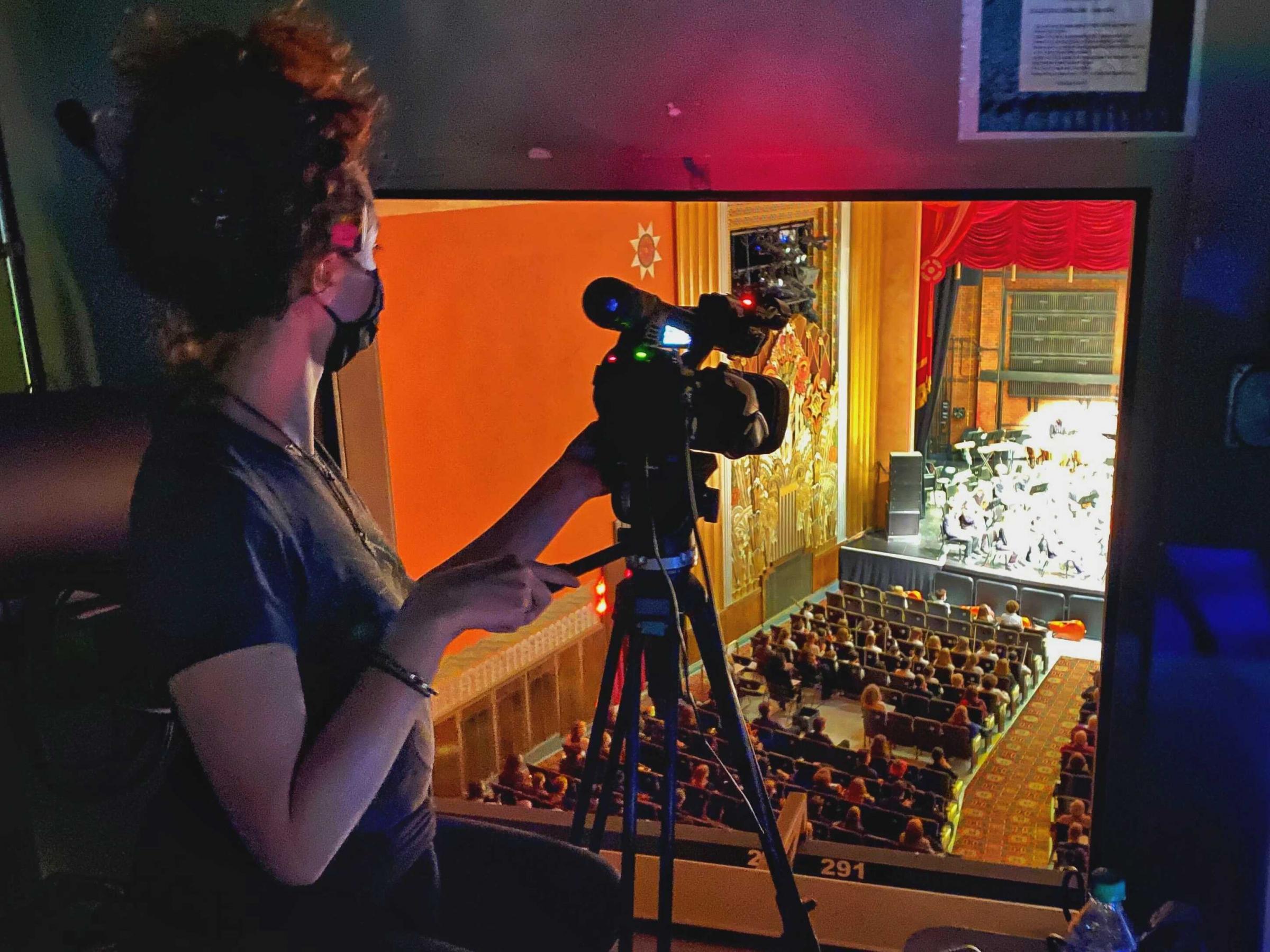 Nora filming the VYO performance at the Flynn Theater