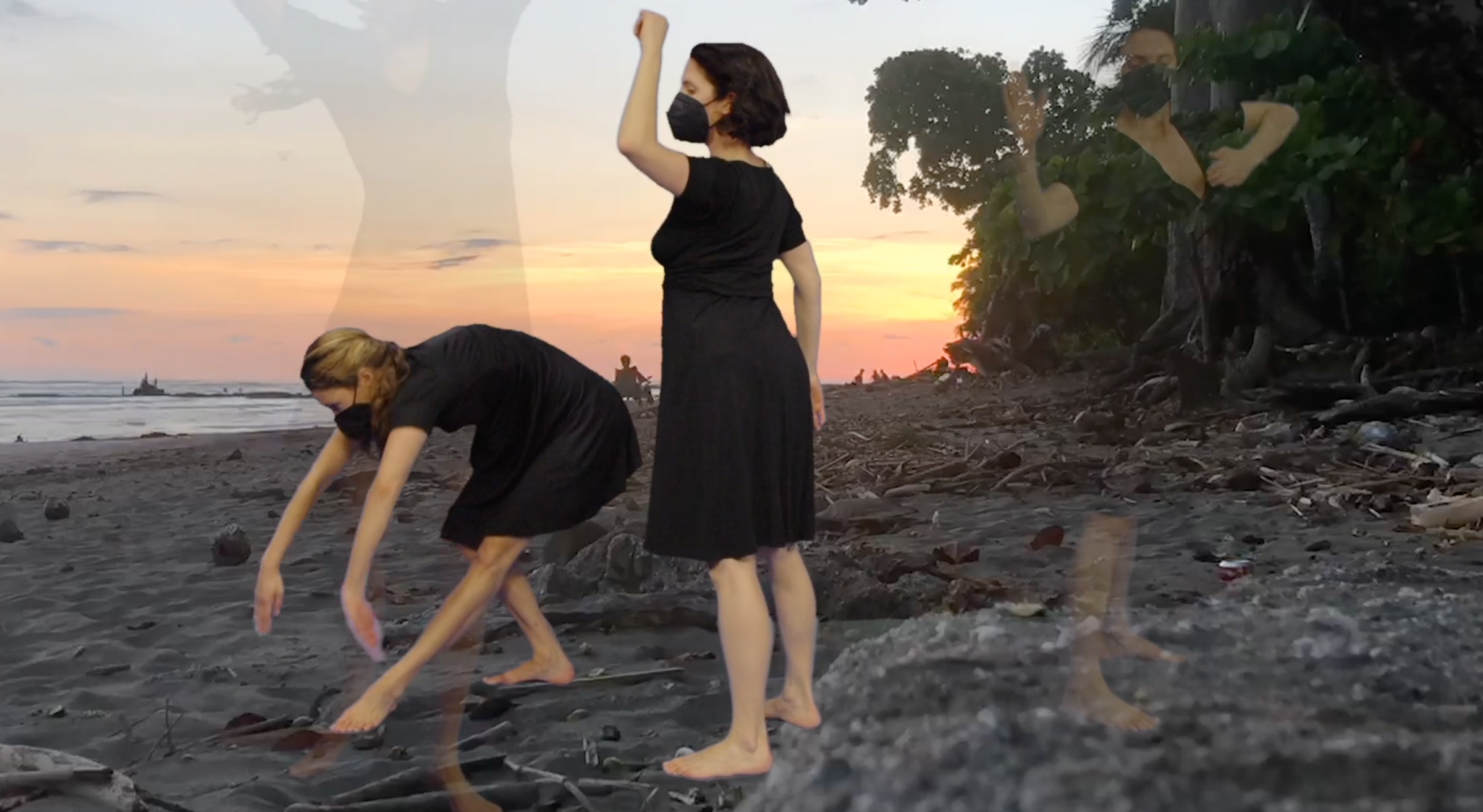 January Sun, a dance performance with two women in black dresses moving in front of a sunset.