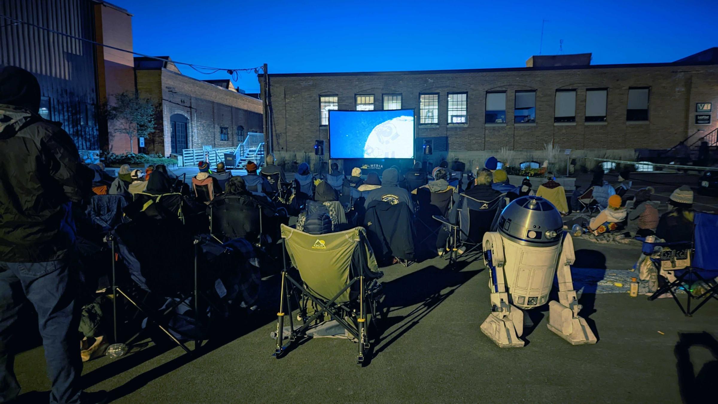 R2D2 and audience watch Crowdsourced Star Wars