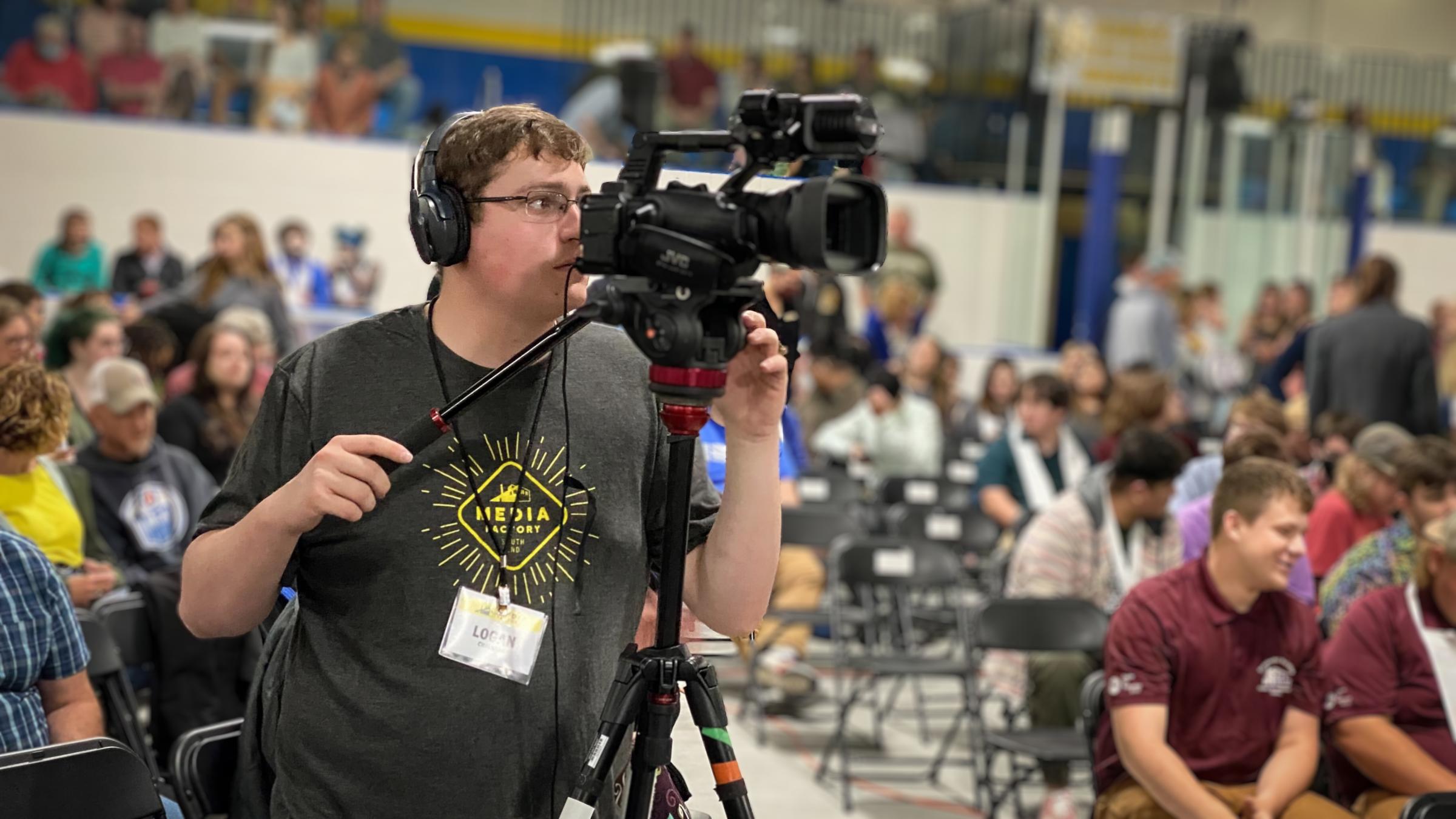 Logan filming at EHS graduation